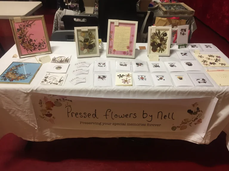 An early Pressed Flowers by Nell stall of cards and framed pieces
