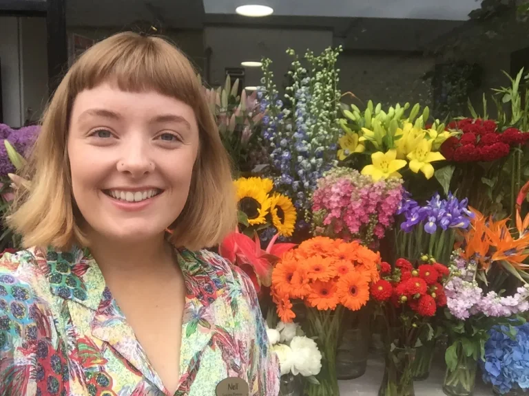Nell among fresh flowers as a florist