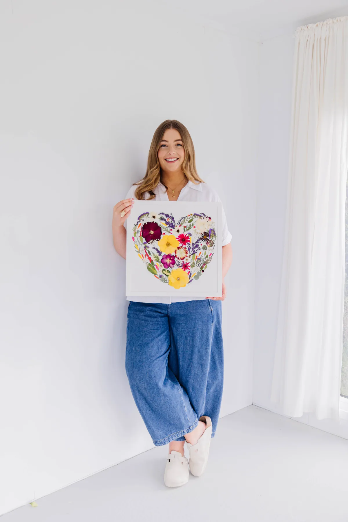 Nell holding a pressed flower heart