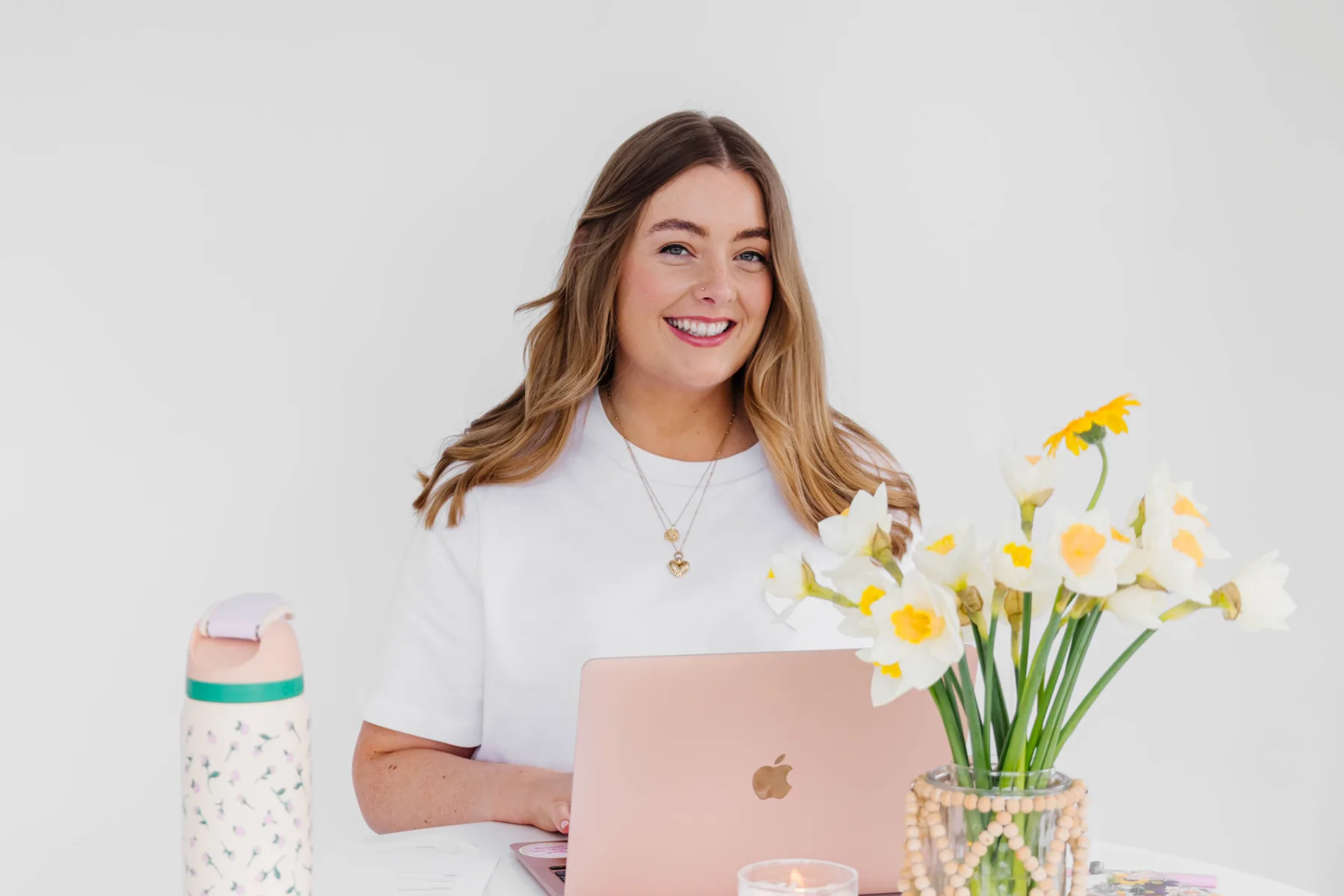 Nell at her laptop in the studio confirming a booking