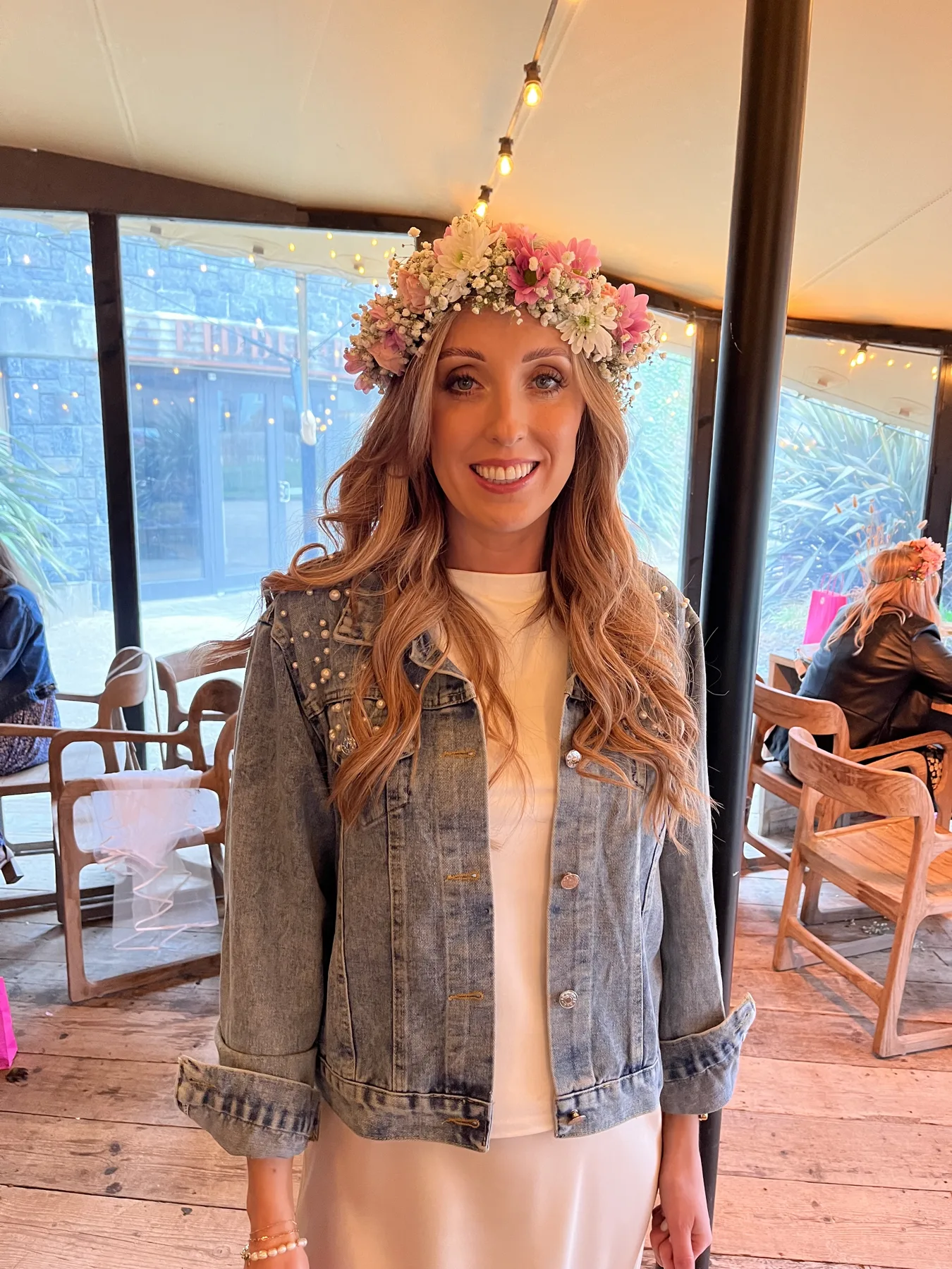 A guest wearing a flower crown at a workshop