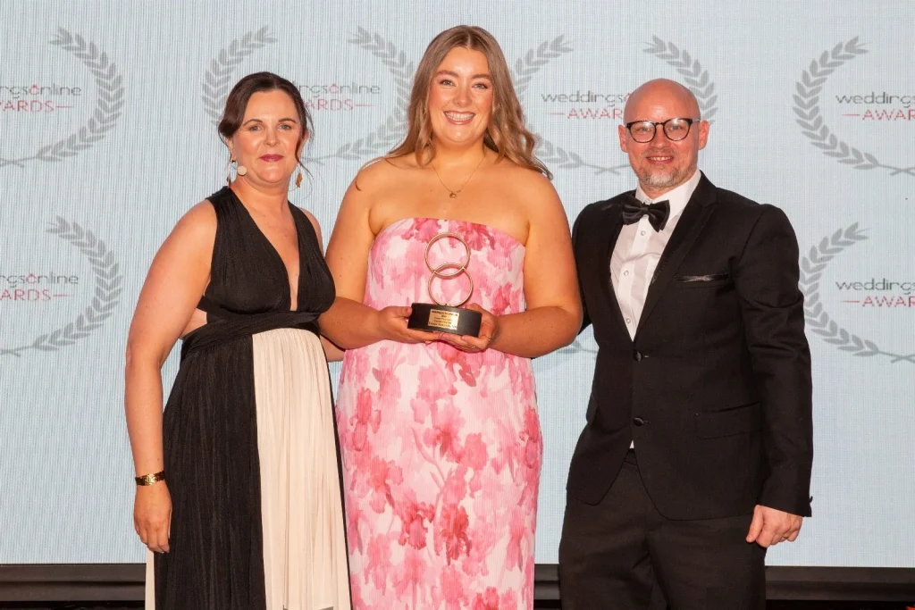 Nell on stage with her WeddingsOnline Award, Flower Preservation Supplier of the Year 2026