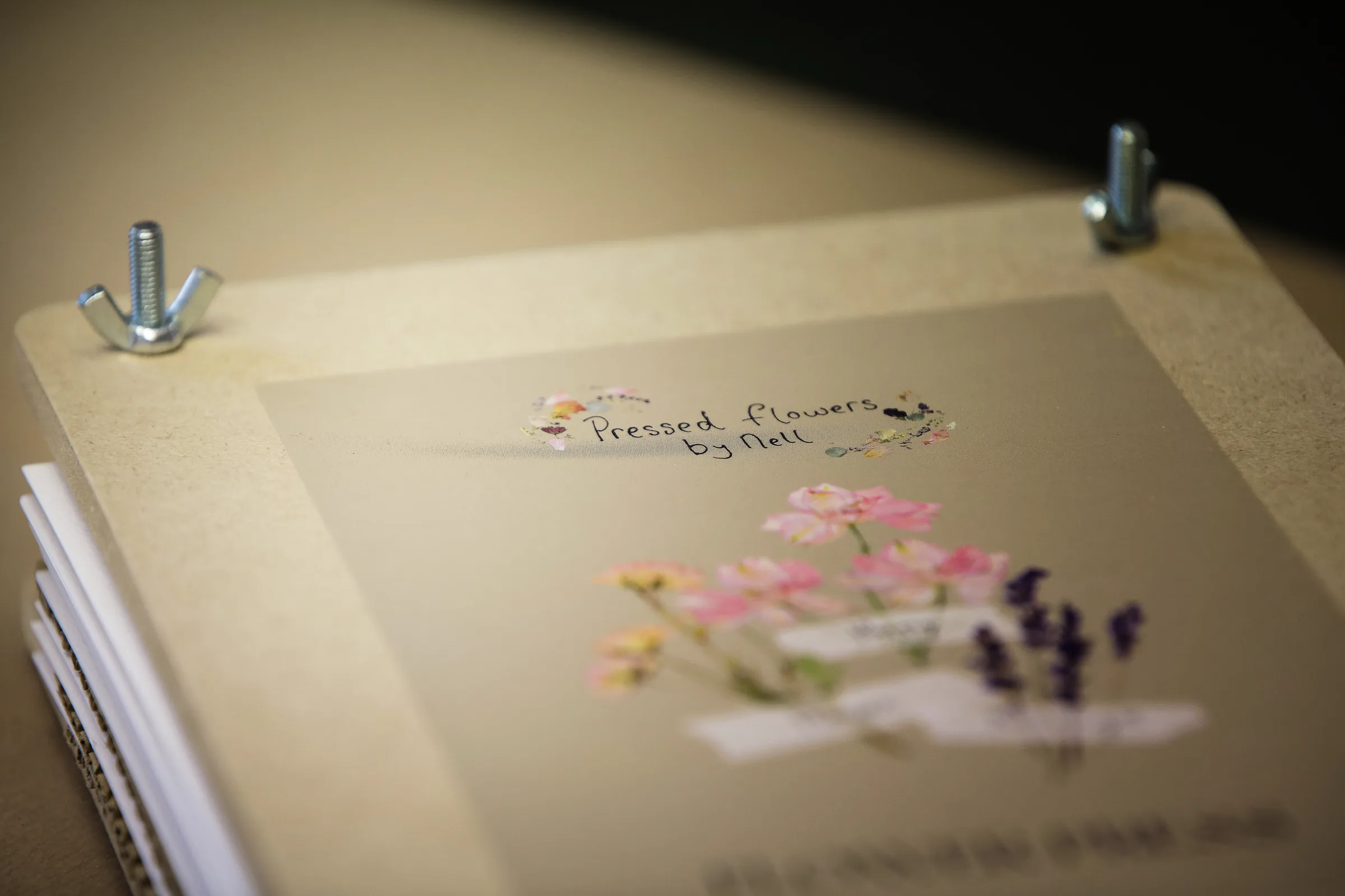 A flower press with a pressed flower design