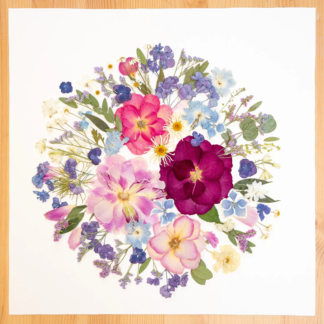 Circle of Love, square design on a wooden table