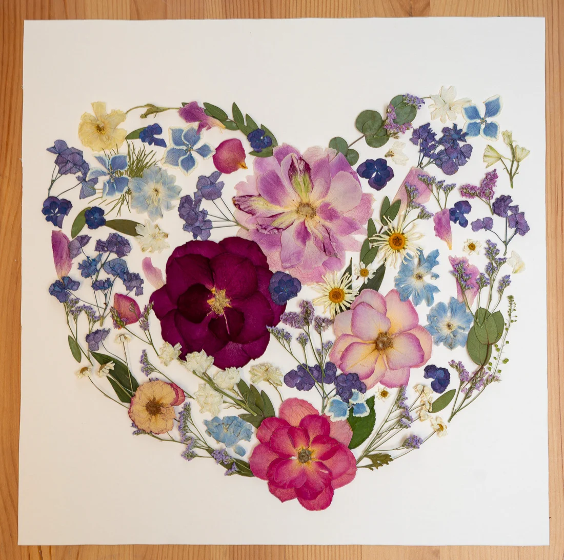 With All My Heart, square design on a wooden table