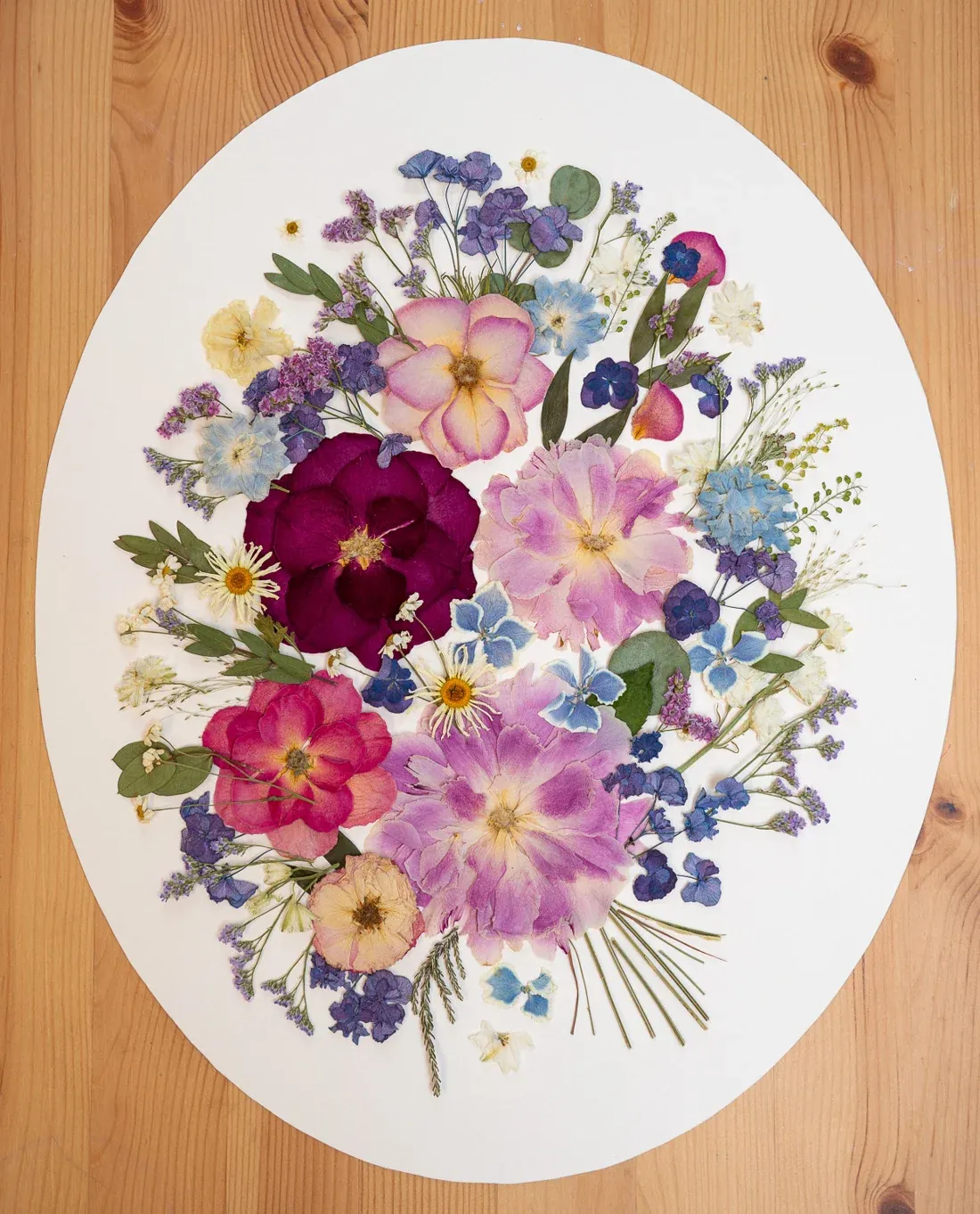 Whispers of Love, oval design on a wooden table