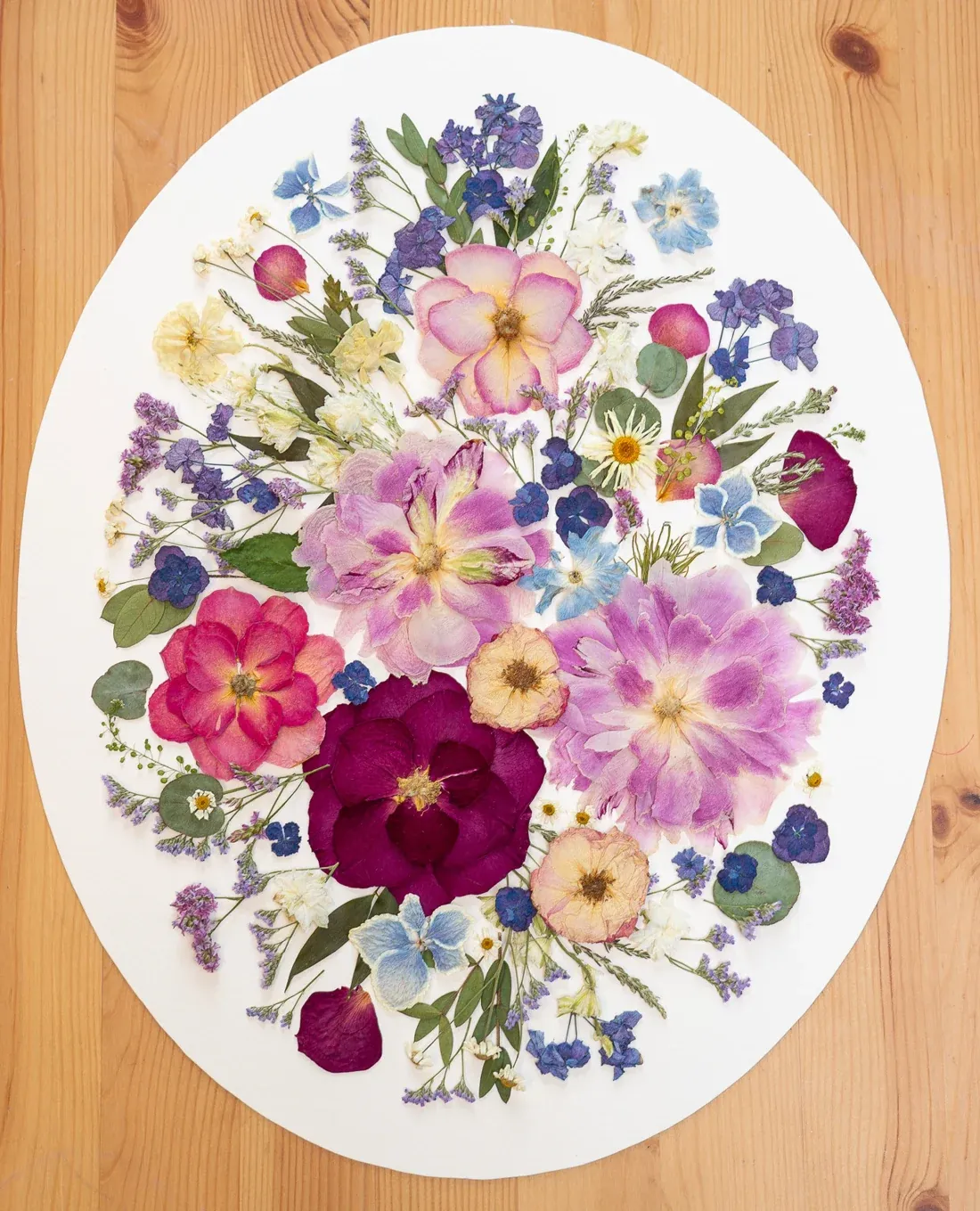 Wildflower Dreams, oval design on a wooden table