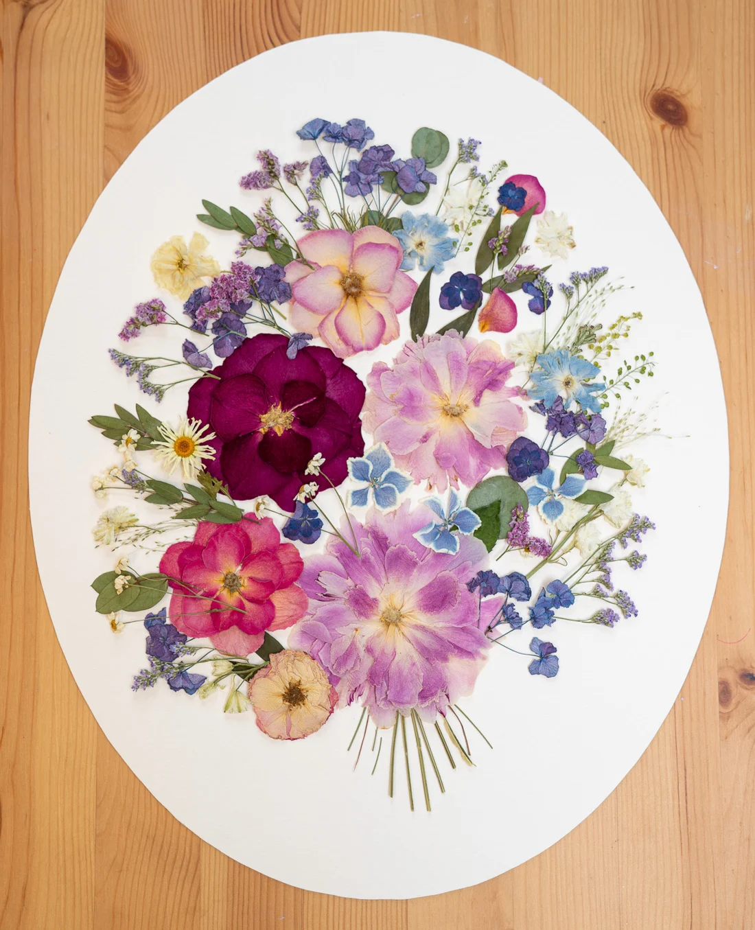 Whispers of Love Story, oval design on a wooden table
