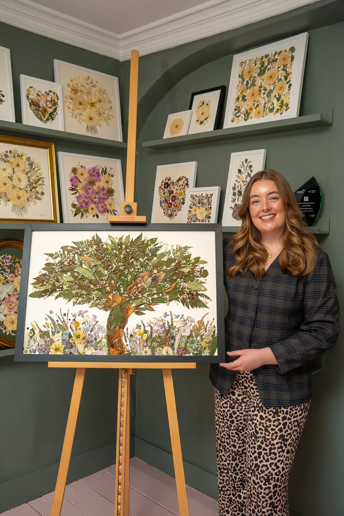Nell with a framed pressed flower tree