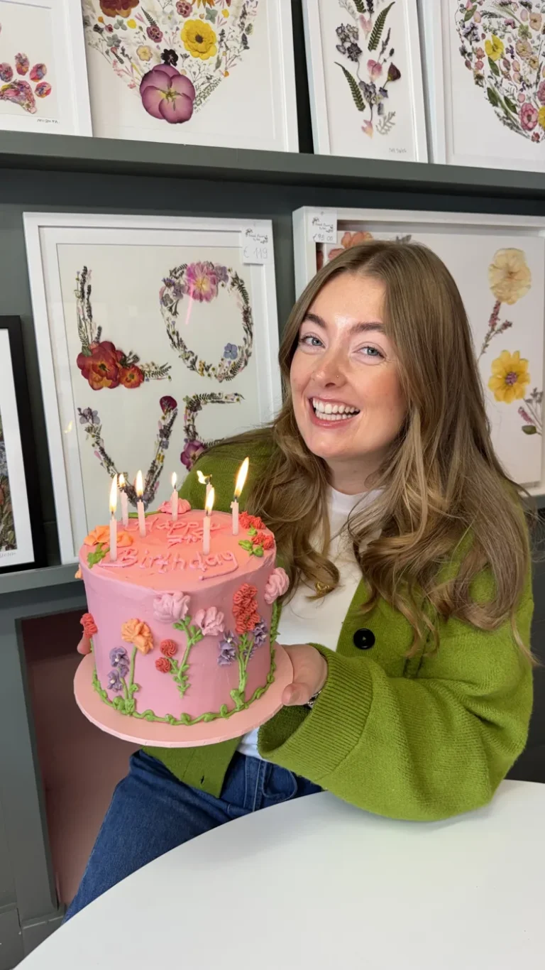 Nell with a seventh birthday cake in the studio